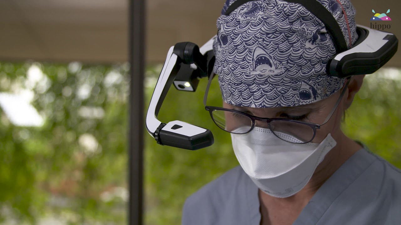 Doctor wearing hippo virtual care headset performing AR in healthcare industry